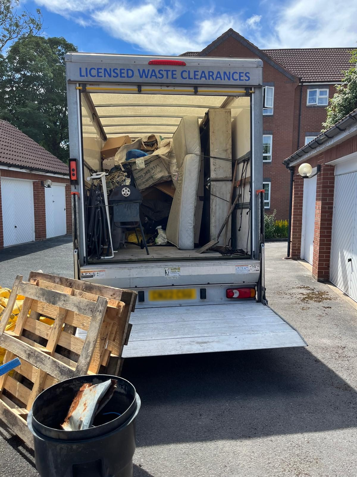 Clearance vehicle loaded with items removed from a garage